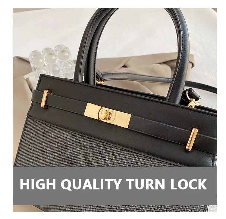 Sac à main noir avec fermeture à loquet de haute qualité, détails dorés élégants