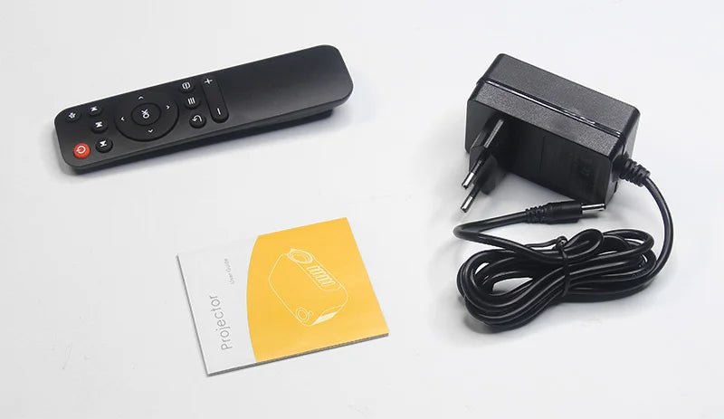 Télécommande, adaptateur secteur et guide d'utilisation pour projecteur high-tech